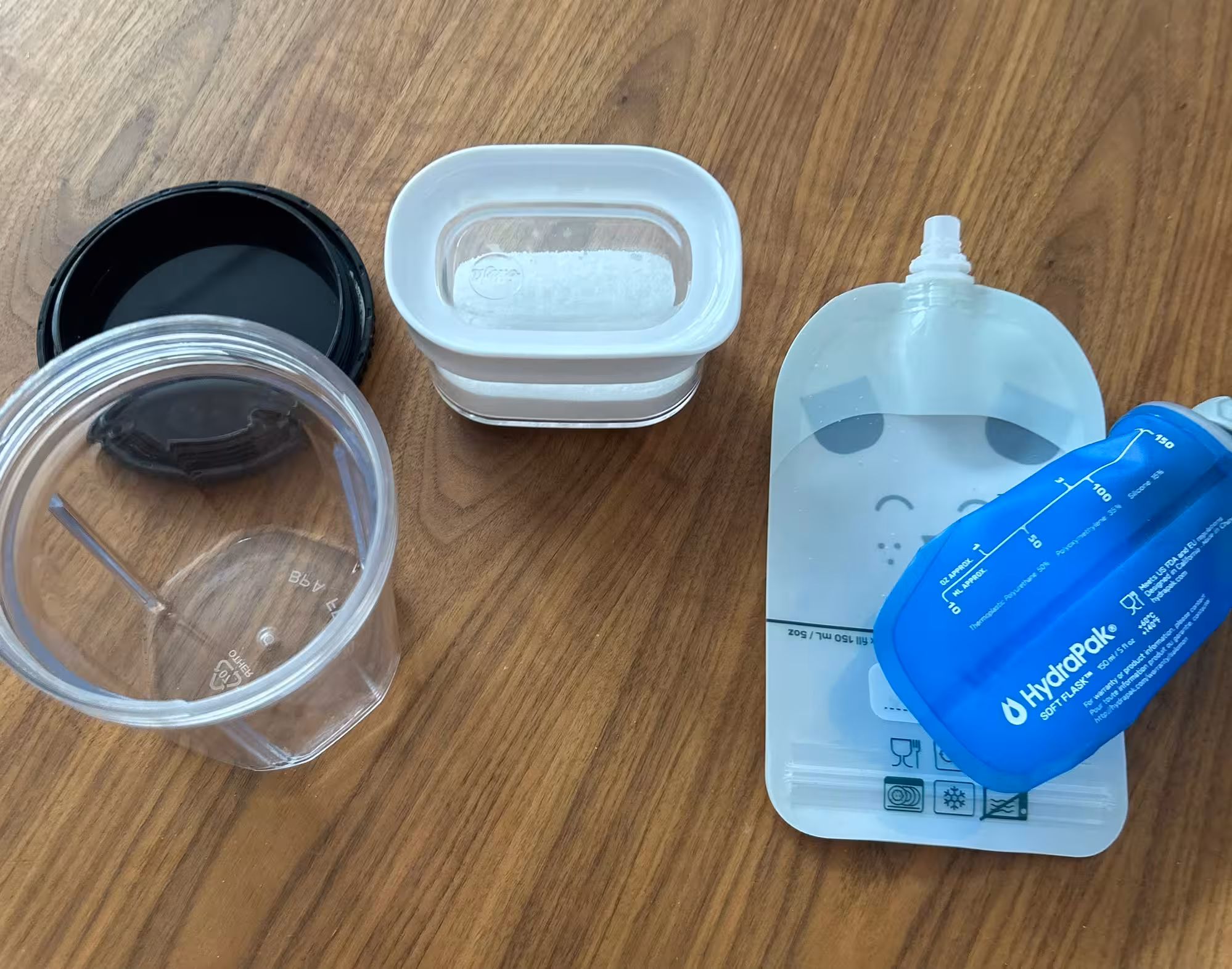Image of powder mixture container with bottle and pouches